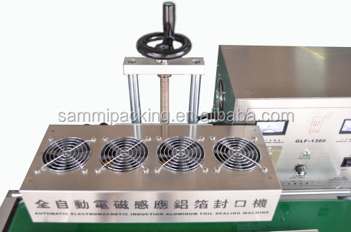 ক্রমাগত ইলেক্ট্রোম্যাগনেটিক ইন্ডাকশন বোতল সিলার আধা-স্বয়ংক্রিয় খাদ্য পানীয় প্যাকিং মেশিন 50 মিমি থেকে 120 মিমি
